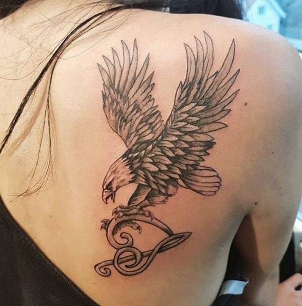 An engaging eagle tattoo design on back shoulder for Women