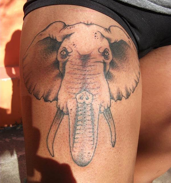 A cool elephant tattoo design on thigh for Ladies