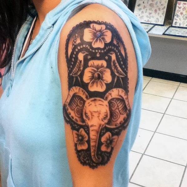 A magical elephant tattoo design on shoulder for Women