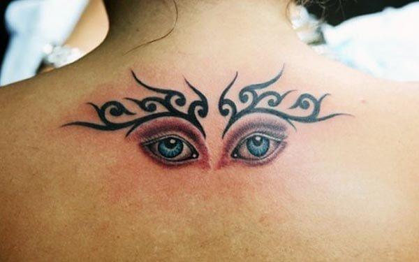 A delightful eye tattoo design on back for Girls and women