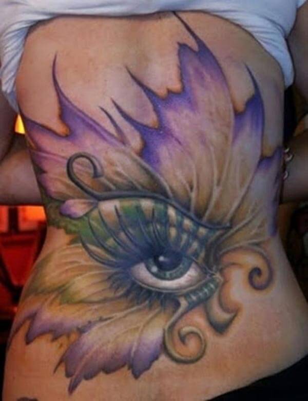 A magical eye tattoo design on full back for Women