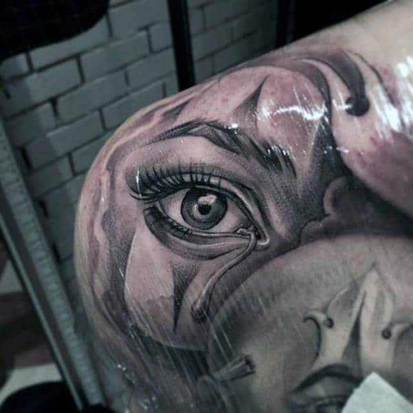 A jaw dropping eye tattoo design on back shoulder for Women.