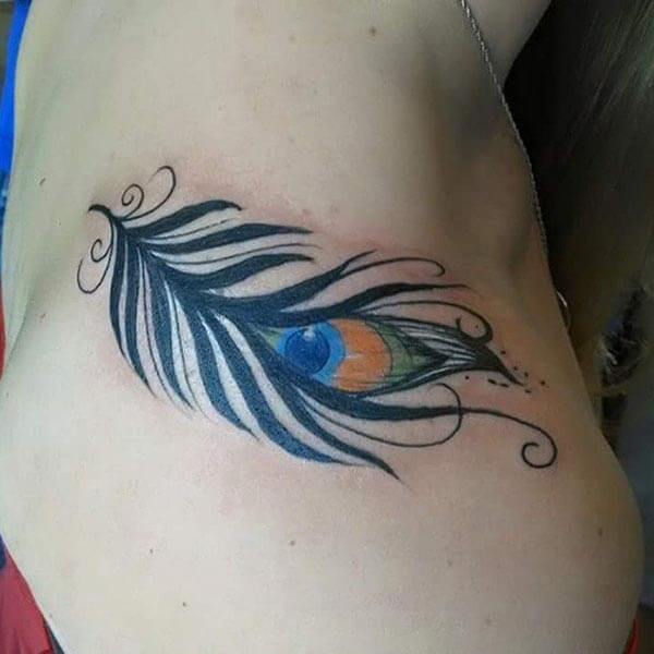 A brilliant feather tattoo design on back shoulder for Ladies