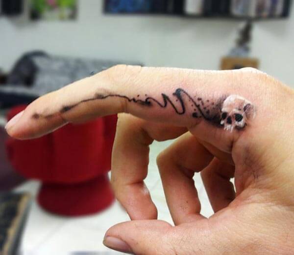 Awesome finger tattoo design on index finger for Women