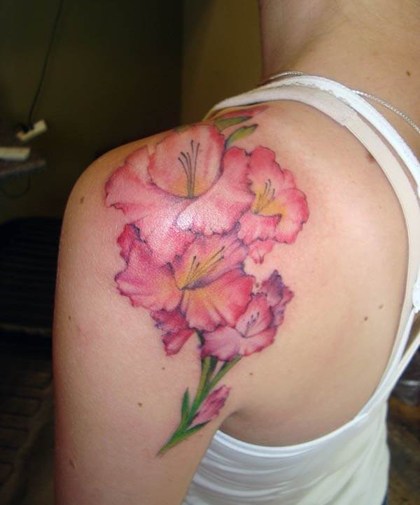 A wonderful flower tattoo design on shoulder for Women