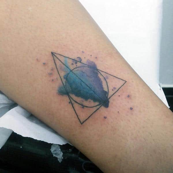 An artistic geometric tattoo design on forearm for women