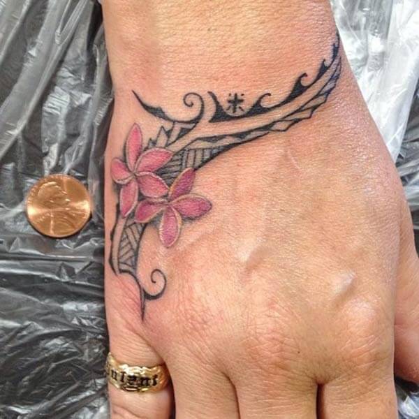 An engaging hand tattoo design on wrist for women