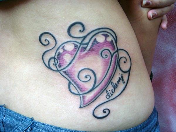 A dreamy heart tattoo design on side belly for girls