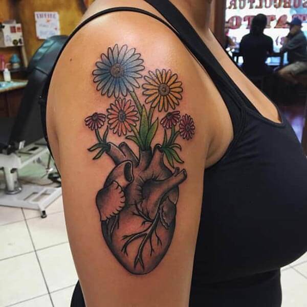A beautiful heart tattoo design on side shoulder for ladies