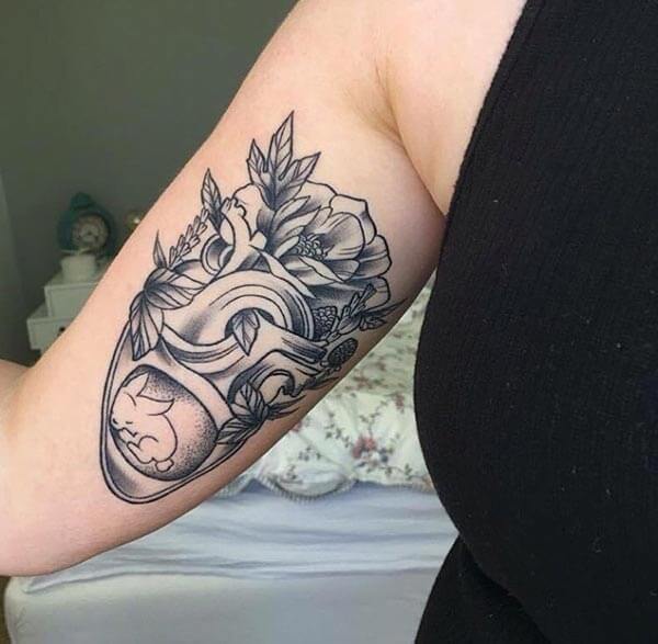 A captivating heart tattoo design on inside arm for Ladies