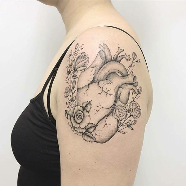 An impressive heart tattoo design on shoulder for girls