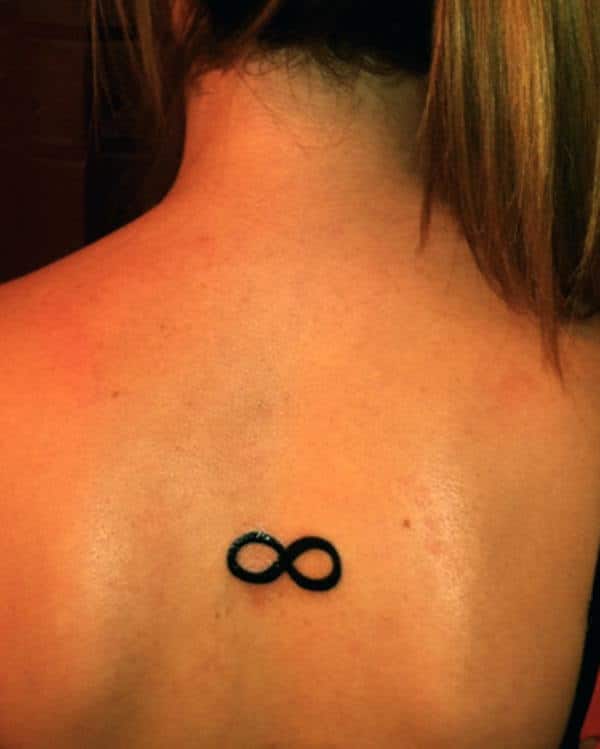 A simple infinity tattoo design on back for ladies