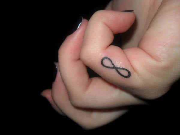 An adorable infinity tattoo design on little finger for women