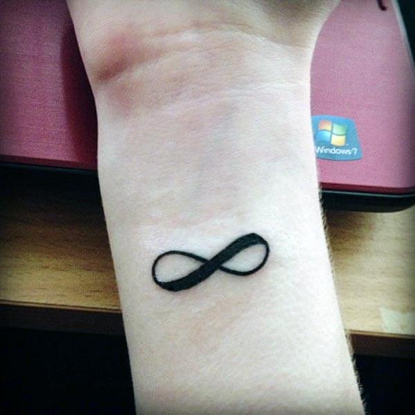 An engaging infinity tattoo design on wrist for girls