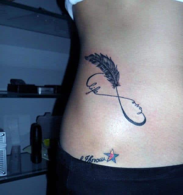A creative infinity tattoo design on side belly for ladies