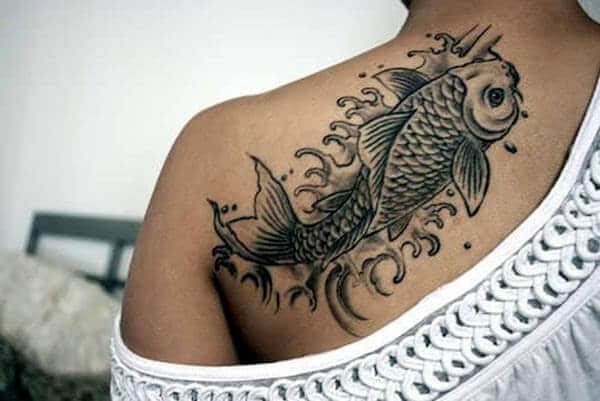 An attractive Koi fish tattoo design on back shoulder for Girls