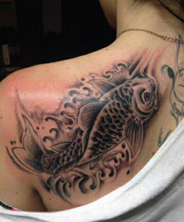 An outstanding Koi Fish tattoo on back shoulder of a Lady