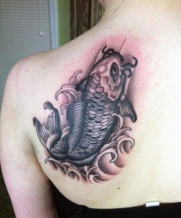 A striking Koi Fish tattoo design on back shoulder for Women