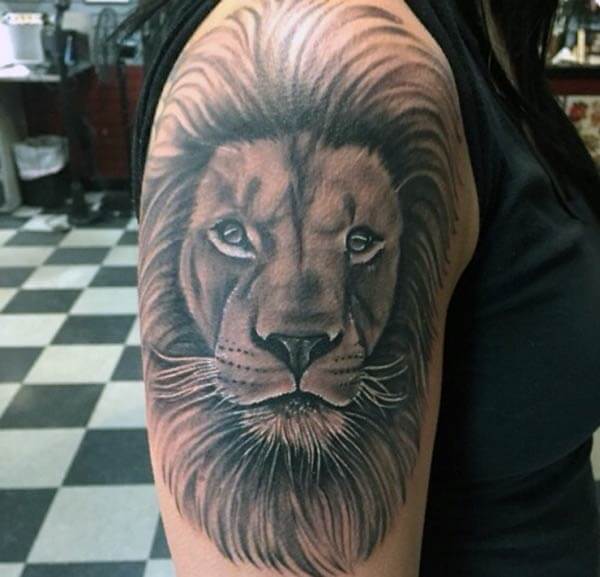 A magnificent lion tattoo design on shoulder for ladies