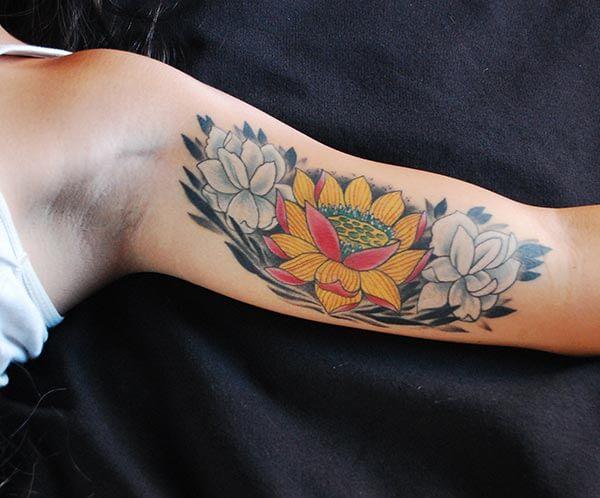 An elegant lotus tattoo design on arm for Women