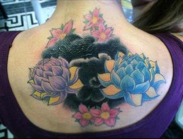A captivating lotus tattoo design on back for girls