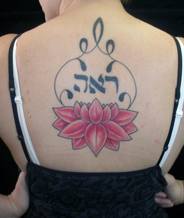 A lovely lotus tattoo design on back for ladies