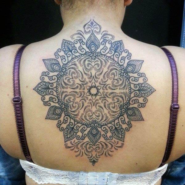 An intricate mandala tattoo design on back for Ladies