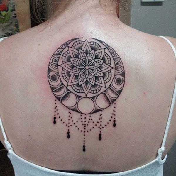 A creative mandala tattoo design on back for girls