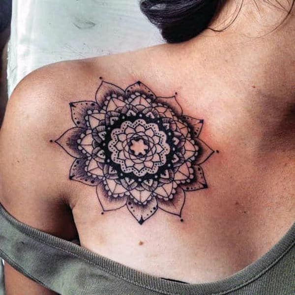 A charming mandala tattoo design on front chest for girls
