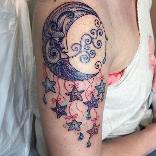 A breathtaking moon tattoo design on upper arm for Ladies