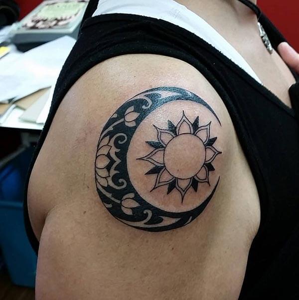 An attractive moon tattoo design on shoulder for ladies