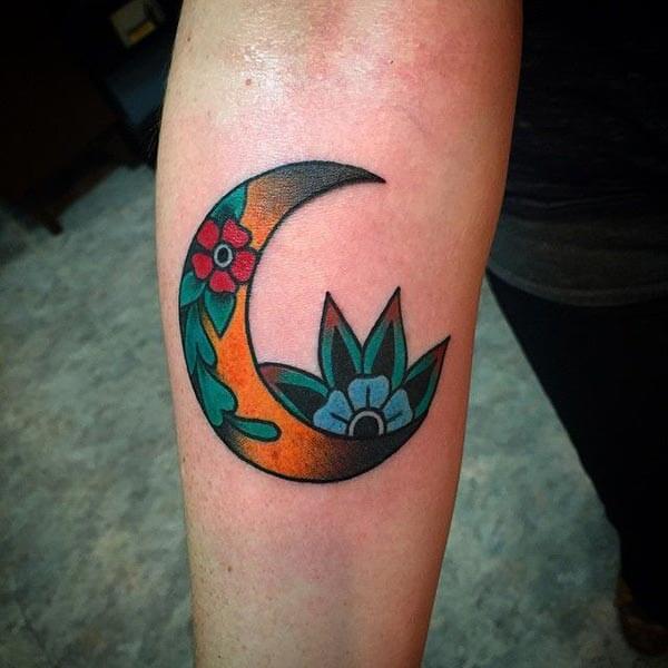 A ravishing moon tattoo design on forearm for Girls