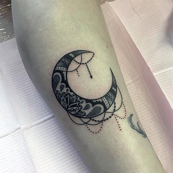 A stunning moon tattoo design on leg for Women