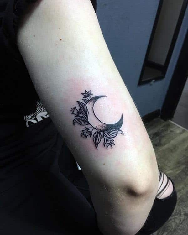 A cute little moon tattoo design on forearm for Women