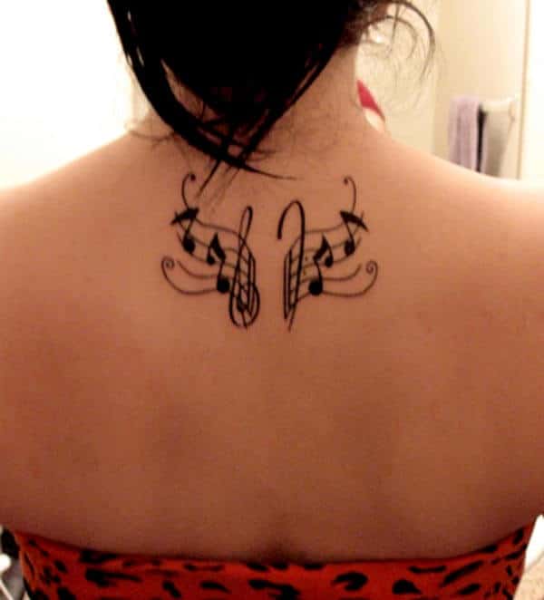 An heavenly music tattoo design on back for Girls and women