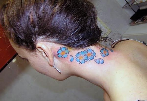 A pretty tattoo design on back neck for girls