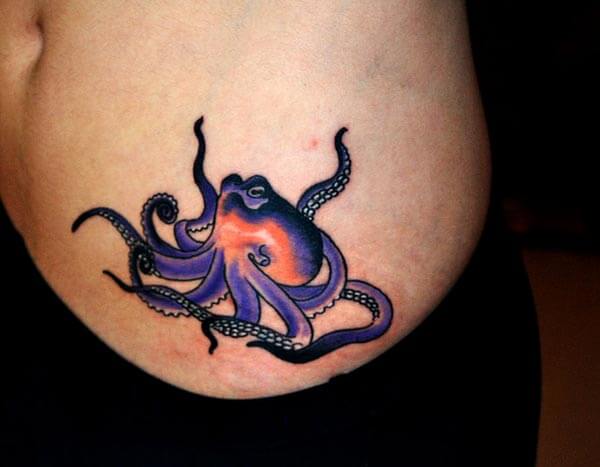 A classy octopus tattoo design on side belly for ladies