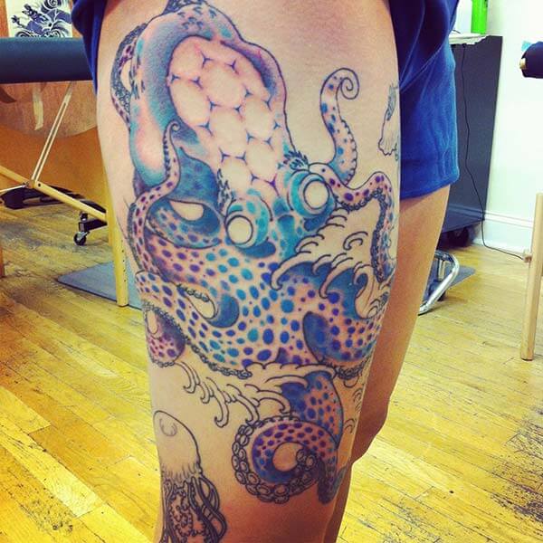 A magnificent octopus tattoo design on thigh for females