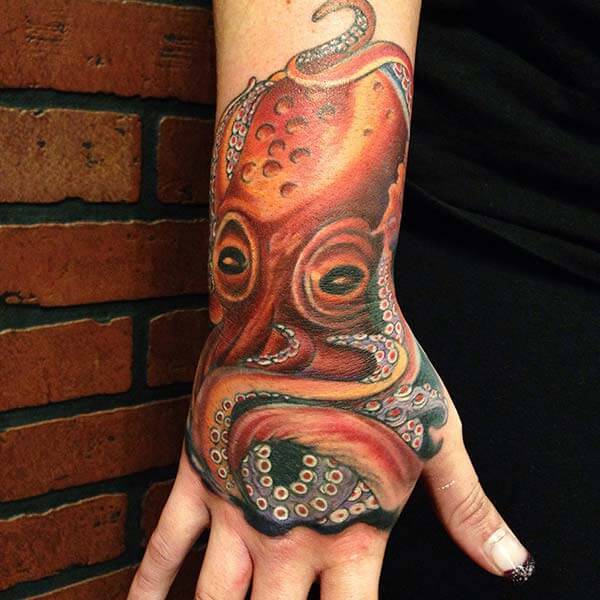 A breathtaking octopus tattoo design on palm back for ladies