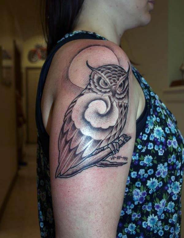 A beautiful owl tattoo design on shoulder for women