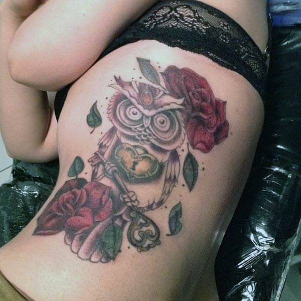 A mesmerizing owl tattoo design on side belly for Girls