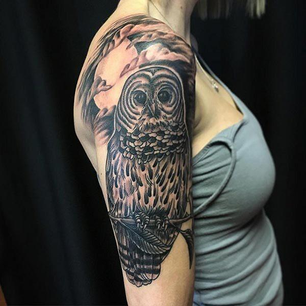 A breath taking owl tattoo design on upper arm for girls and women