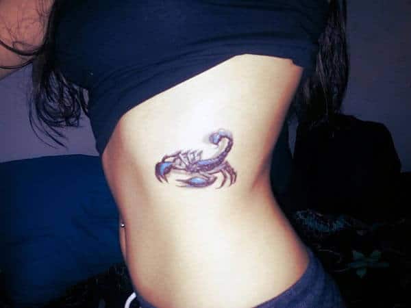 A sexy scorpion tattoo design on side belly for women