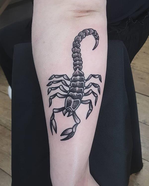 A wonderful scorpion tattoo design on upper arm for girls and women
