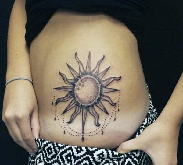 A sexy sun tattoo design on side belly for Girls and women