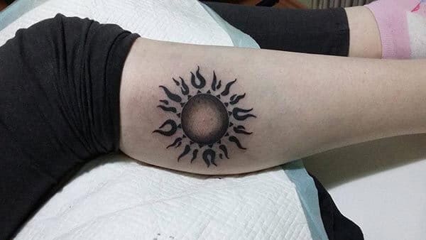 A lovely sun tattoo design on arm for Ladies and girls