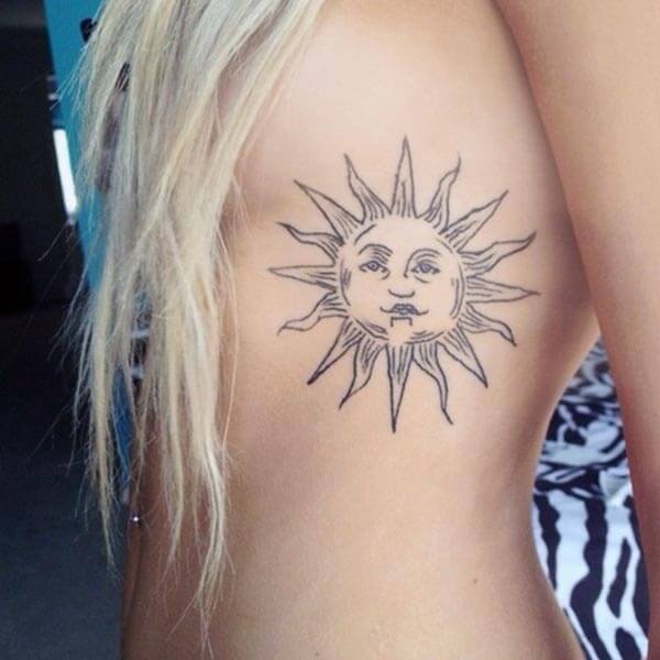 A mesmerizing sun tattoo design on side rib for Ladies