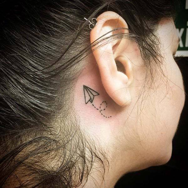 A cool behind the ear tattoo design for Women
