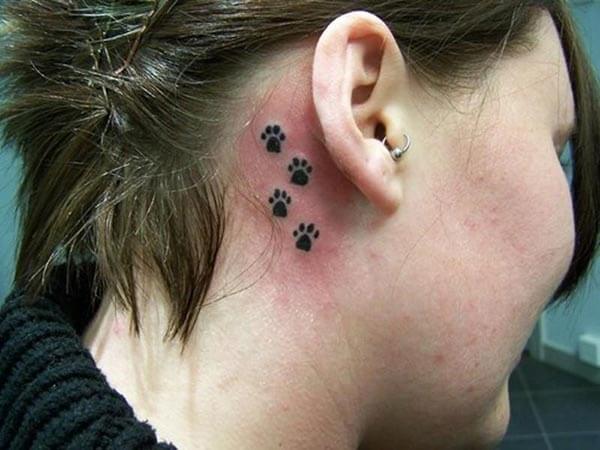 A lovely behind the ear tattoo design for girls and women