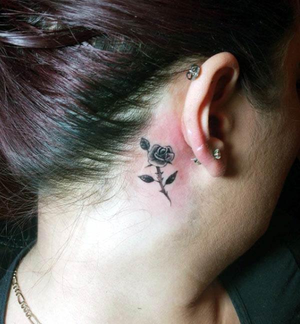 A beautiful behind the ear tattoo design for women